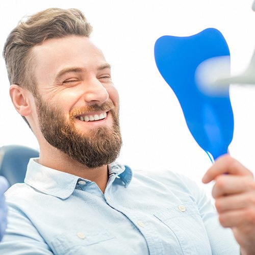 Parsippany patient smiling with dental implants