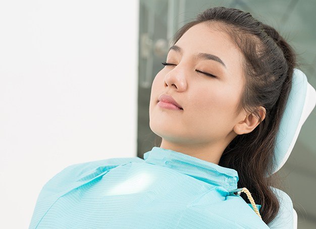 Woman relaxing under sedation dentistry