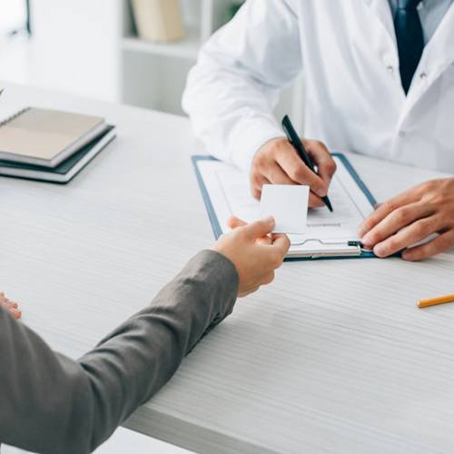 Dentist discussing the cost of tooth extractions in Parsippany