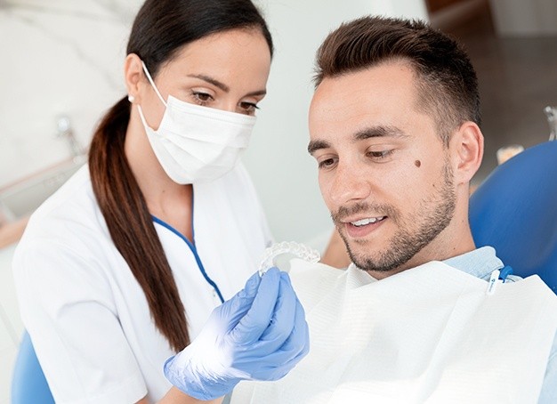 Patient and orthodontist discussing Invisalign treatment