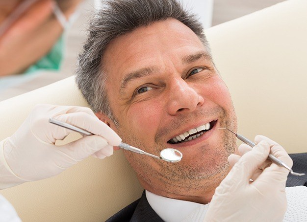 Man smiling during recare appointment