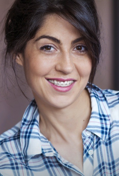 Young woman with brces smiling