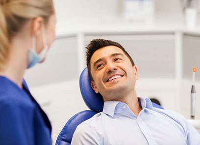 Man smiling at cosmetic dentist in Parsippany