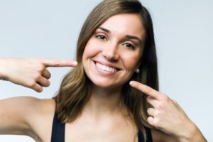 woman pointing at smile