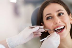 Smiling woman in the dental chair