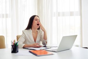 woman yawning at work 