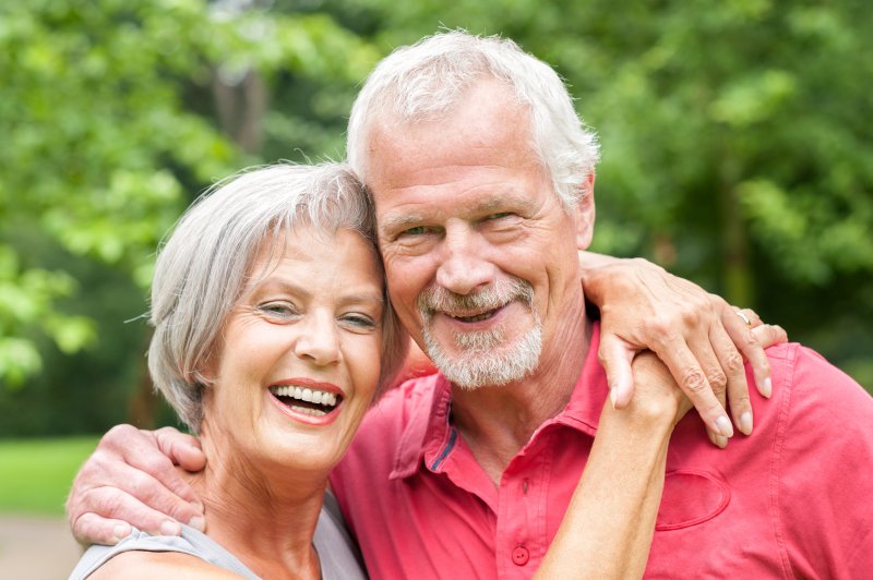 couple smile with dental implants in Parsippany