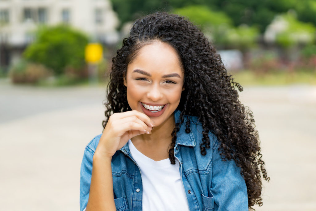 young person with braces smiling