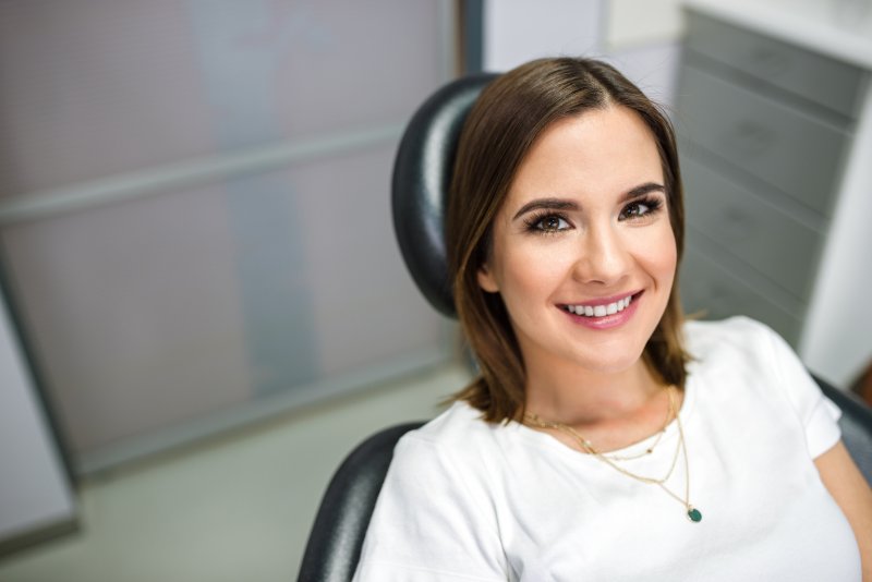 smiling patient after getting a smile makeover