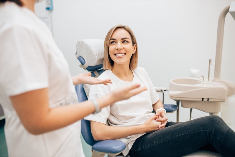 person learning about the benefits of porcelain veneers