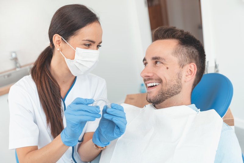 A dentist answering Invisalign questions in Parsippany