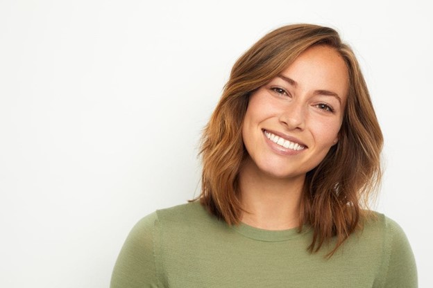 person with porcelain veneers smiling 