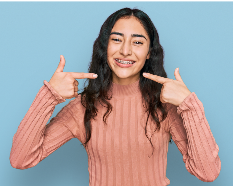Girl pointing at braces