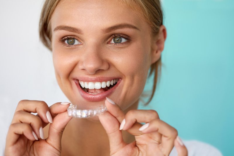 Patient smiling with Invisalign