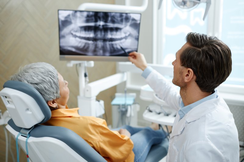 Patient talking to dentist about dental emergency